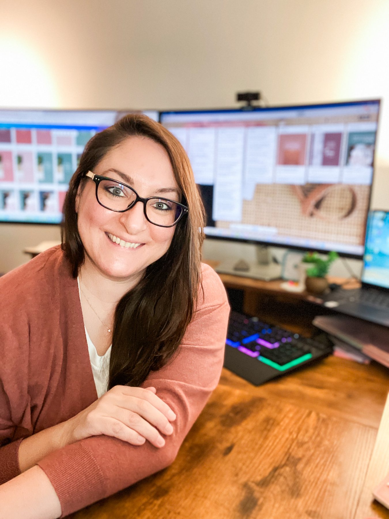 Codi Leigh, holistic marketing strategist, at her desk