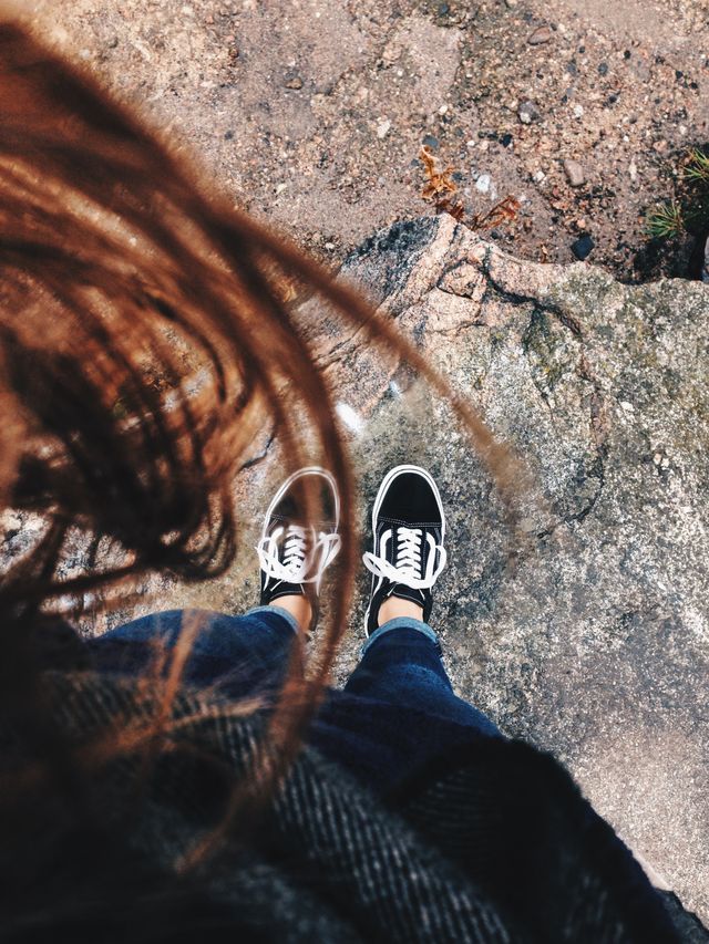 woman looking down at her shoes